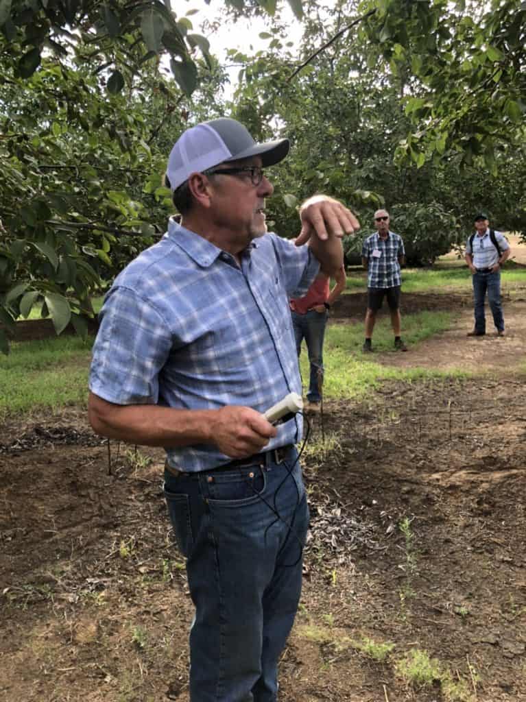 James Pingrey presenting in orchard