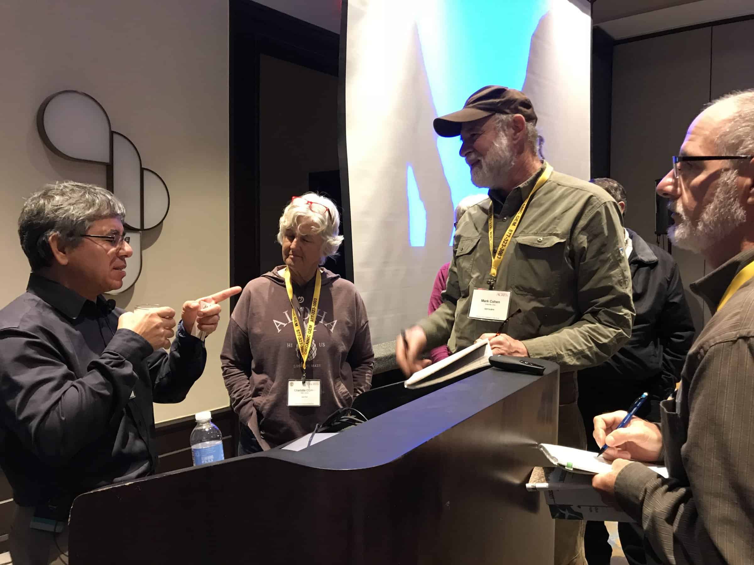 Reginaldo Haslett-Marroquin talks with audience members after his 2018 Eco-Ag Conference session.