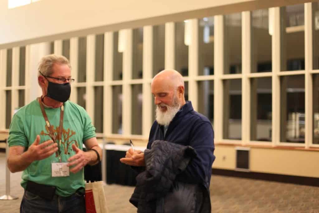 Fred Provenza speaking with an Eco-Ag Conference attendee